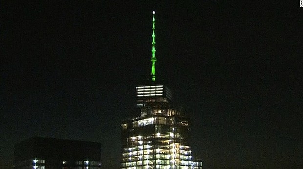 One World Trade Center lit up green in solidarity with Paris climate accord