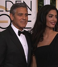 George Clooney and his wife, Amal Clooney