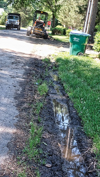 Cityscape // City employees begin work in the West End as part of the Department of Public Works’ blitz to improve 1,300 alleys by the end of August. Last Saturday an alley bounded by Staples Mill Road, Chantilly Street and Augusta and Fitzhugh avenues received needed attention. 