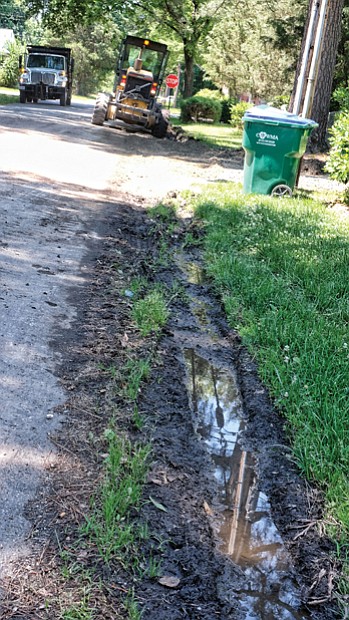 Cityscape // City employees begin work in the West End as part of the Department of Public Works’ blitz to improve 1,300 alleys by the end of August. Last Saturday an alley bounded by Staples Mill Road, Chantilly Street and Augusta and Fitzhugh avenues received needed attention. 