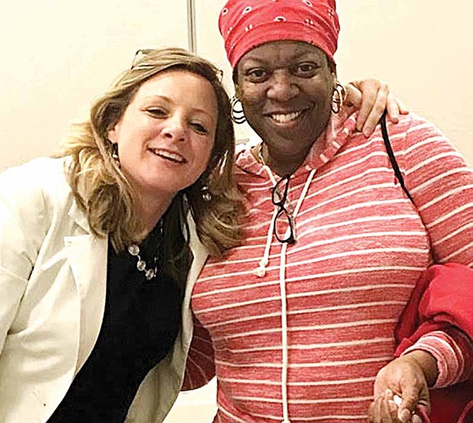 Life Matters Media President Randi Belisomo [pictured left] celebrates with a participant [pictured right] in a “Starting the Conversation”program at Avalon Library.