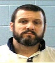 A manhunt is underway for two inmates who killed two corrections officers Tuesday, June 13, 2017 morning in central Georgia's Putnam County, Georgia Bureau of Investigation spokeswoman Nelly Miles said. Donnie Russell Rowe, 43, is one of the inmates.