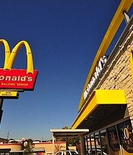 An exterior angle photograph of a new style McDonald's Restaurant.
