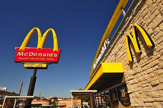 An exterior angle photograph of a new style McDonald's Restaurant.