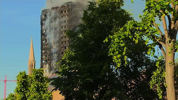 	A still smoking Grenfell Tower, several hours after the fire started.