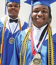 John Marshall High School valedictorian Tyreil Mayo, right, and salutatorian Gregory Jones, show their many medals and honor cords before their graduation Wednesday at the Altria Theater.