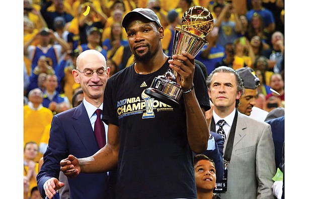 Kevin Durant of the Golden State Warriors celebrates after winning the MVP Award on Monday after Game 5 of the NBA finals at Oracle Arena in Oakland, Calif.