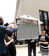 From left, Richmond Mayor Levar M. Stoney, Gov. Terry McAuliffe, Sen. Jennifer L. McClellan, Sen. Rosalyn R. Dance and ACLU of Virginia Executive Director Claire Guthrie Gastañaga help unveil the new state marker outside the Patrick Henry Building at 11th and Broad streets.