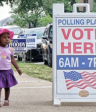 Voter in training// 
Zahria Blocker, 17 months, accompanies her grandfather, Levonne Johnson, to the voting precinct on Tuesday so he could cast his ballot in the primary election. The youngster is getting early lessons on the importance of voting. Location: 31st Street Baptist Church in the East End.  