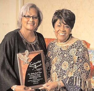 Gladys Piper (L), State Treasurer's Office, accepts her Leadership Award from Dr. Mildred C. Harris, founder and CEO, God First Church and Ministries, at the Annual Community Prayer Breakfast, held recently at the Chicago Hilton. For three decades, the Prayer Breakfast has been bringing together communities and leaders in government, education, business and religion to pray for the city, celebrate its people and accomplishments, provide financial scholarships and recognize individuals for their work improving neighborhoods.