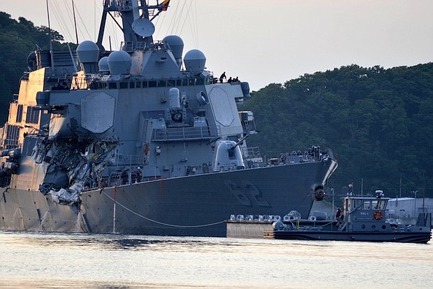 The damaged USS Fitzgerald returns to port in Yokosuka following a collision with a merchant vessel.