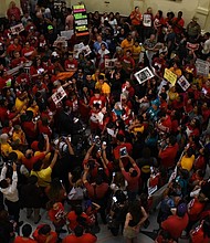 floor of the state Capitol is packed with protesters/Texas Tribune