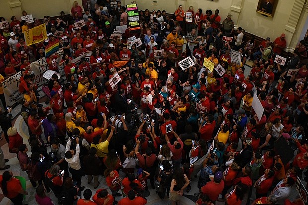 floor of the state Capitol is packed with protesters/Texas Tribune