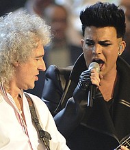 Brian May of Queen (left) and Adam Lambert perform at the MTV Europe Music