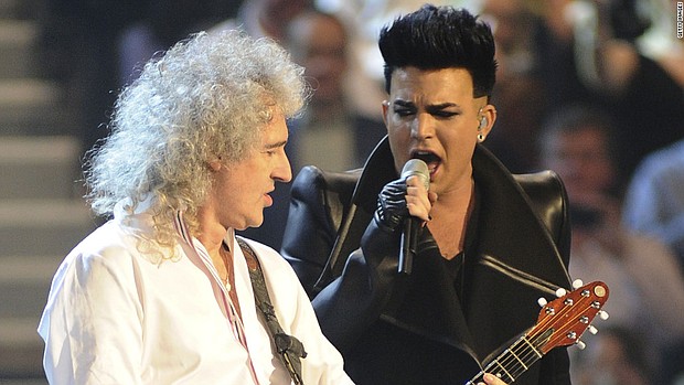 Brian May of Queen (left) and Adam Lambert perform at the MTV Europe Music