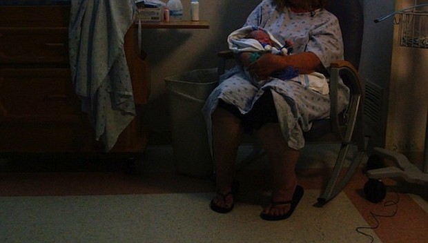 	Debbie rocks her grandson, gently cradling the newborn in the specialized neonatal unit at Cabell Huntington Hospital. When the boy was born in early June, he was going through opioid withdrawal