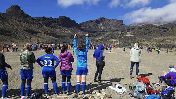 	The squad of 30 footballers representing 20 nationalities, who included retired US international Lori Lindsey and former England midfielder Rachel Unitt, completed a 11-a-side match at nearly 19,000 feet playing a 90-minute football match on Mount Kilimanjaro, an altitude never attempted before.