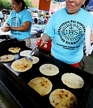 Sacred Heart’s RVA Latino Festival //

Virginia Garcia of Richmond makes pupusas, a traditional dish from her native El Salvador consisting of a thick tortilla stuffed with a savory filling.