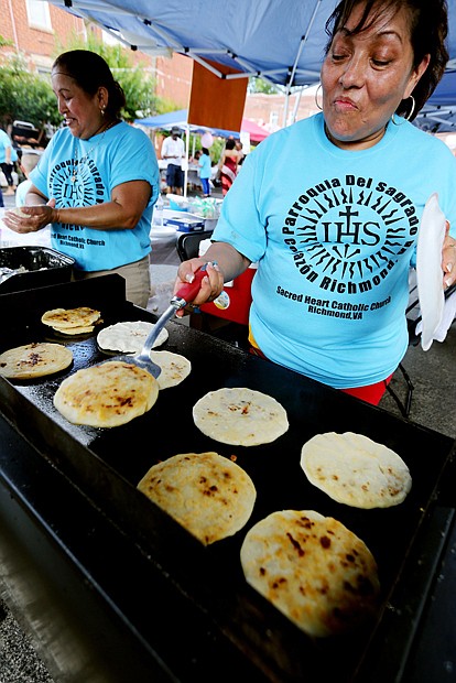 Sacred Heart’s RVA Latino Festival //

Virginia Garcia of Richmond makes pupusas, a traditional dish from her native El Salvador consisting of a thick tortilla stuffed with a savory filling.