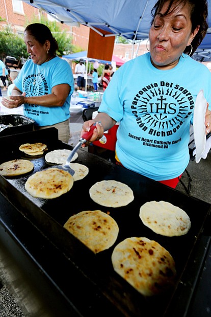 Sacred Heart’s RVA Latino Festival //

Virginia Garcia of Richmond makes pupusas, a traditional dish from her native El Salvador consisting of a thick tortilla stuffed with a savory filling.