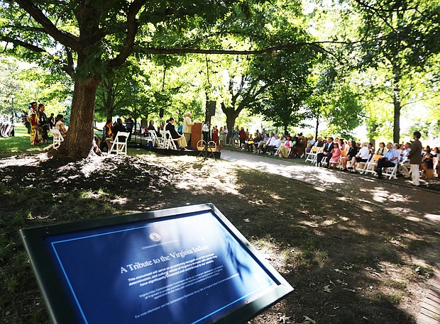 Blessing the grounds //
Hundreds of people gather at Capitol Square in Downtown last Saturday for the groundbreaking for the Native American monument. Speakers included Alan Michelson, a Mohawk, whose design, “Mantle,” was chosen for the monument, and Olympic gold medalist Billy Mills, below left, a member of the Oglala Lakota tribe. 