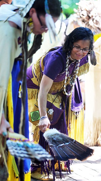 Blessing the grounds //The ceremony included a blessing of the grounds with the Virginia Indian Dancers and the Turtle Clan Drummers. Dr. Denise Walters, left, of Henrico County, a member of the Nottoway Tribe, participates in the blessing, while other members of the tribe
