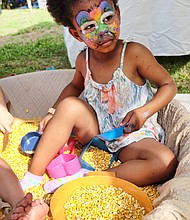 Meatless, but hardy //
There is no meat, but everything is tasty at the Richmond Vegetarian Festival last Saturday at Bryan Park. The annual event showcases an array of vegan and vegetarian dishes by local vendors. Top left, Imani Seay, 4, plays in a box of corn rather than a traditional sandbox