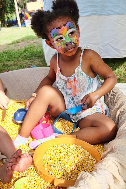 Meatless, but hardy //
There is no meat, but everything is tasty at the Richmond Vegetarian Festival last Saturday at Bryan Park. The annual event showcases an array of vegan and vegetarian dishes by local vendors. Top left, Imani Seay, 4, plays in a box of corn rather than a traditional sandbox