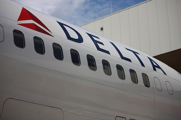 A Delta Airlines jet sits on the tarmac 