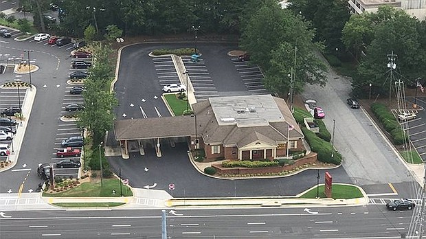 Police are on the scene of a standoff and hostage situation at the Wells Fargo location at 2675 Windy Hill Road in Marietta.