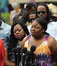 Allysza Castile, sister of Minnesota shooting victim Philando Castile, weeps as she addresses the crowd outside the Ramsey County Courthouse in St. Paul, Minn., on June 16, after police officer Jeronimo Yanez was acquitted of criminal charges in her brother’s death. 