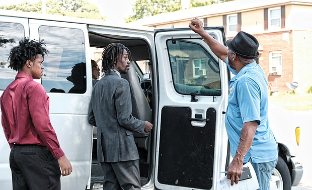 Amir Robinson, left, and Steven Hicks board the van from Hillside Court in South Side to head to job interviews last Friday at Food Lion on Jefferson Davis Highway. Wyatt Kingston, right, organized the effort with Richmond Redevelopment and Housing Authority officials. 