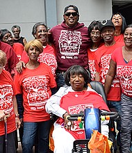 Master P poses with elderly residents who live at Guste Homes in New Orleans, LA