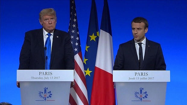 Trump and Macron took questions from reporters in Paris amid a swirl of controversy over his oldest son's meeting with a Russian lawyer.