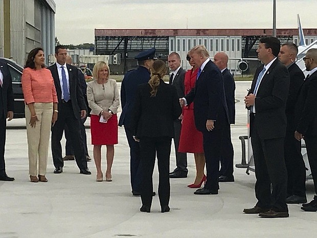 	President Trump arrives at Charles de Gaulle airport.
