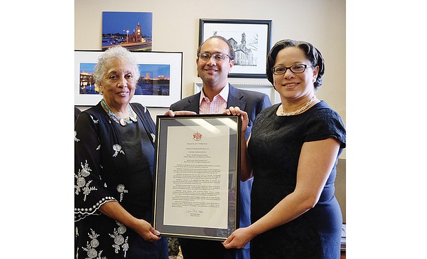 State Sen. Jennifer L. McClellan, right, presents Free Press Publisher Jean Patterson Boone with a resolution honoring the award-winning newspaper on its 25th anniversary of serving and informing people in the Greater Richmond community. The presentation, also attended by Raymond H. Boone Jr., Free Press vice president of new business development, was held Tuesday in Sen. McClellan’s office in the Pocahontas Building on Capitol Square. The resolution was co-sponsored by the Richmond and Henrico delegations, Sen. McClellan noted, and was passed by the General Assembly earlier this year. The resolution commended the publication on its commitment to “free expression and robust debate” and its work to “facilitate openness and accountability in local and state government,” along with its efforts to address complex issues facing the people in the Richmond area.
