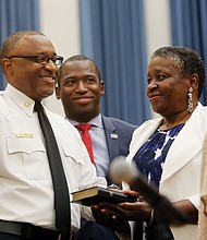 He’s officially on duty //
Melvin D. Carter takes the oath of office Monday as the 21st chief of the Richmond Department of Fire and Emergency Services. His mother proudly holds the Bible as the 54-year-old Richmond native takes the oath of office in the City Council Chamber with Mayor Levar M. Stoney nearby.   