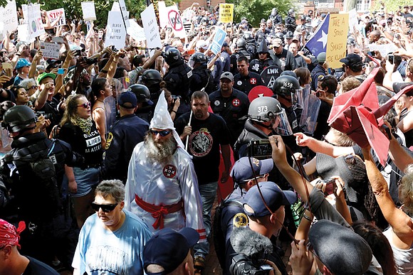 More than 1,000 people turned out to shout down a group of Ku Klux Klan members last Saturday at a ...