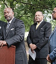 King Salim Khalfani, Richmond managing director for Americans Resisting Minority and Ethnic Discrimination, commends the lawsuit seeking to overturn a state policy of withholding Hepatitis C medicine from inmates. Looking on, from left, are: Michael Donovan, Nexus Services president and CEO, whose company is funding the lawsuit; the Rev. Frank Jackson, managing director of ARMED’s Chicago office; and Mario Williams, lead attorney with Nexus Caridades Attorneys that is representing inmates in the suit.  