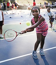 Eye on the ball
Tiffany Smith of Richmond, 6, has her eye on the ball at the Arthur Ashe Tennis Courts in Battery Park. She was among scores of youths who turned out Wednesday, July 12, for the Arthur Ashe Birthday Blast at the park, where they received complimentary tennis lessons and were on hand to celebrate murals created in his honor. A native of Richmond, Mr. Ashe was the first African-American male tennis player to win the U.S. Open, Australian Open and Wimbledon. He was also the first African-American male player to be ranked No. 1. Please see more photos on B2.