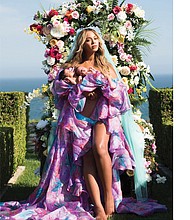 Beyoncé poses with her babies, Rumi and Sir Carter, in an Instagram post on Friday, July 14. The photo received more than 6.5 million “likes” within nine hours of its posting. 
