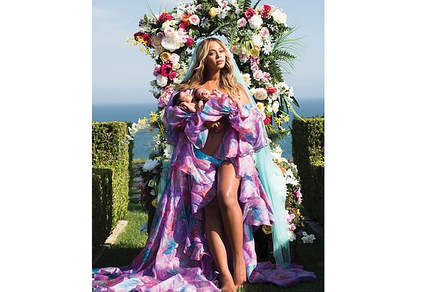 Beyoncé poses with her babies, Rumi and Sir Carter, in an Instagram post on Friday, July 14. The photo received more than 6.5 million “likes” within nine hours of its posting. 
