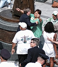 5. City officials, Walker family members, statue sculptor, arts commission members, National Park Service staff and others embrace after the historic unveiling.