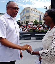 2. Former Mayor Dwight C. Jones, who was instrumental in the city undertaking the statue project, talks with Selena Cuffee- Glenn, Richmond’s chief administrative officer.