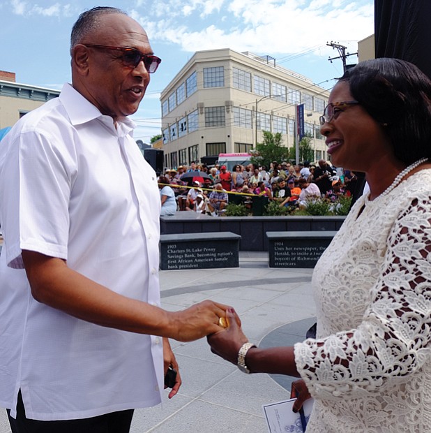 2. Former Mayor Dwight C. Jones, who was instrumental in the city undertaking the statue project, talks with Selena Cuffee- Glenn, Richmond’s chief administrative officer.