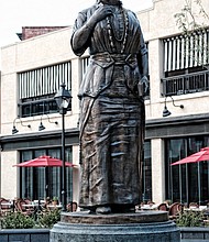 It was a day to remember last Saturday as hundreds of people gathered for the unveiling of the Maggie L. Walker statue in the new plaza at Broad and Adams streets in Downtown. The 10-foot bronze statue of the pioneer businesswoman and icon was revealed to fanfare and cheers on what would have been Mrs. Walker’s 153rd birthday. Speakers included city officials, sculptor Antonio “Toby” Mendez and Walker descendants. The new monument to a true hero serves as a gateway to Jackson Ward, where Mrs. Walker’s home, now a National Park Service historic site, is open to the public. 