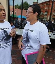 10. Clarice Davis, left, and Fontaine Pate, members of the
Maggie L. Walker High School Class of 1965 wear T-shirts made
for the day.