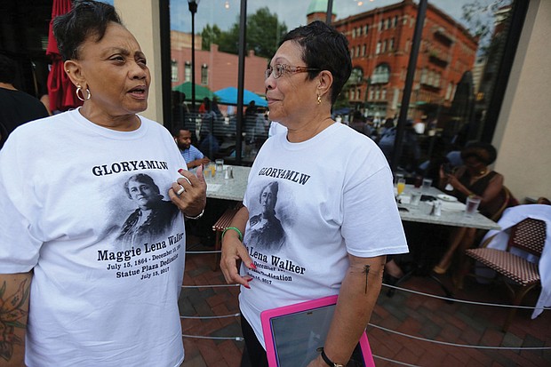 10. Clarice Davis, left, and Fontaine Pate, members of the
Maggie L. Walker High School Class of 1965 wear T-shirts made
for the day.