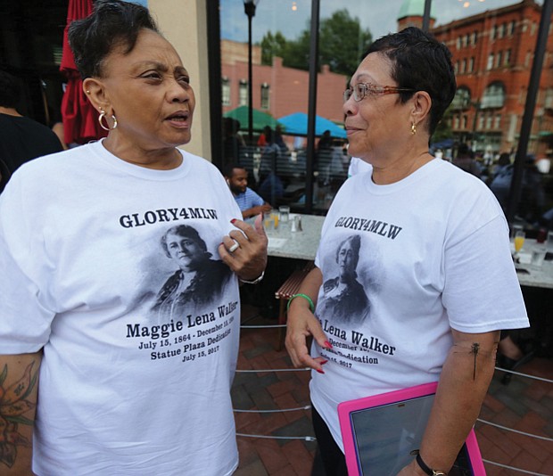 10. Clarice Davis, left, and Fontaine Pate, members of the
Maggie L. Walker High School Class of 1965 wear T-shirts made
for the day.