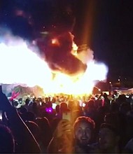 Police say more than 22 thousand fans were evacuated after a fire started on a stage at the Tomorrowland music festival in Barcelona.